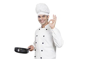 Male Chef Cook Frying pan Showing oksign