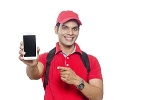 Indian Courier Man Showing Smartphone Pointing
