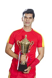 INdian Man Football Player Trophy Victory