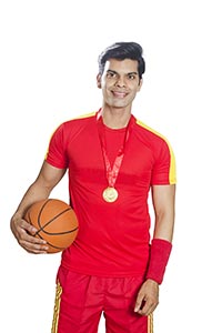 Smiling Basketball Player Medal Holding Ball