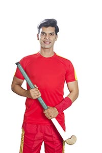 Indian Sports Hockey Player Holding Hockey Stick