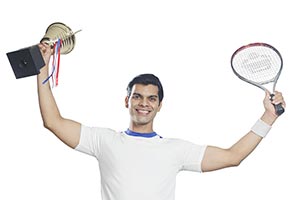 Indian Tennis Player Celebrates Championship Troph