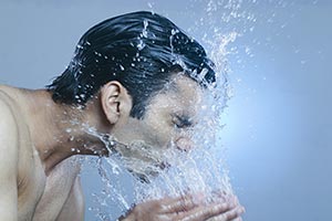 Adult Man Splashing Water Face