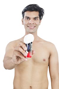 Indian  Men Shpwing shaving Cream Bottle