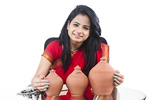 Indian Businesswoman Saving Money Piggybank