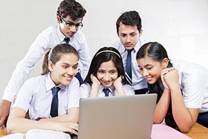 Group School Students Watching Laptop