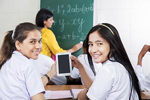 School Girls Classroom Using Tablet