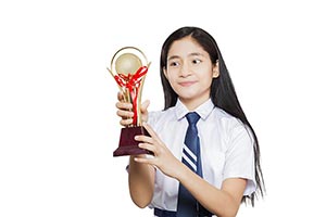 Girl Student Winning Trophy