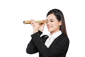 Businesswoman LookingThrough Telescope