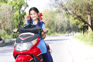 School Girl Riding Scooty