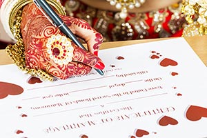 Bride Signing Marriage Certificate