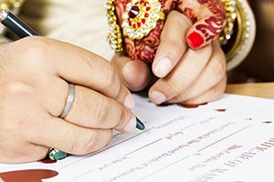 Groom Signing Marriage Certificate