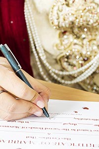 Groom Signing Marriage Certificate