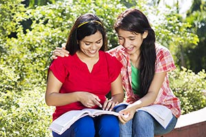 2 People ; Arm Around ; Bench ; Bonding ; Book ; C